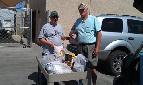 Club president, Alan Friedman, delivers the food and cash donations from the April 20, 2013 Fun Fly
