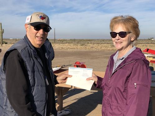 Lynda Nesbitt, President of the Pets In Need Action League, came to the Casa Grande RC Flyers Field this morning to accept a $1,000.00 donation from the Diane Warren Foundation ahead of the club's Saturday event in their honor. 